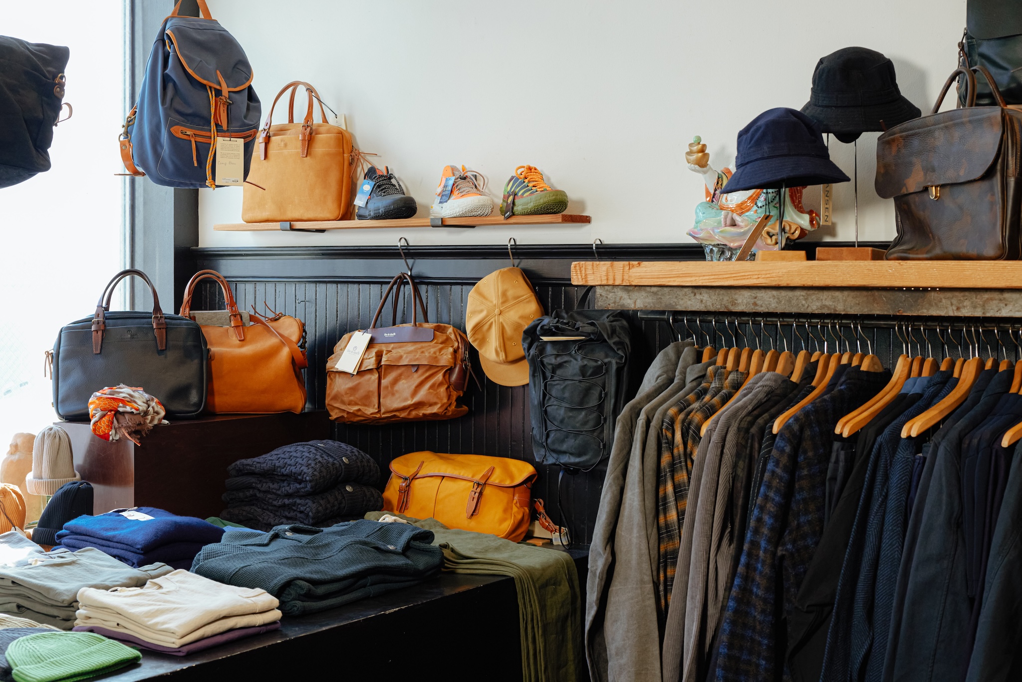 the interior of a stylish menswear retail store