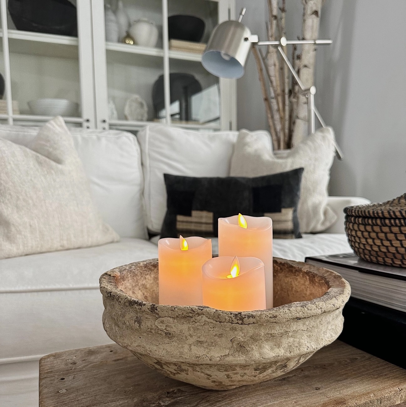 Electric pillar candles in living room.