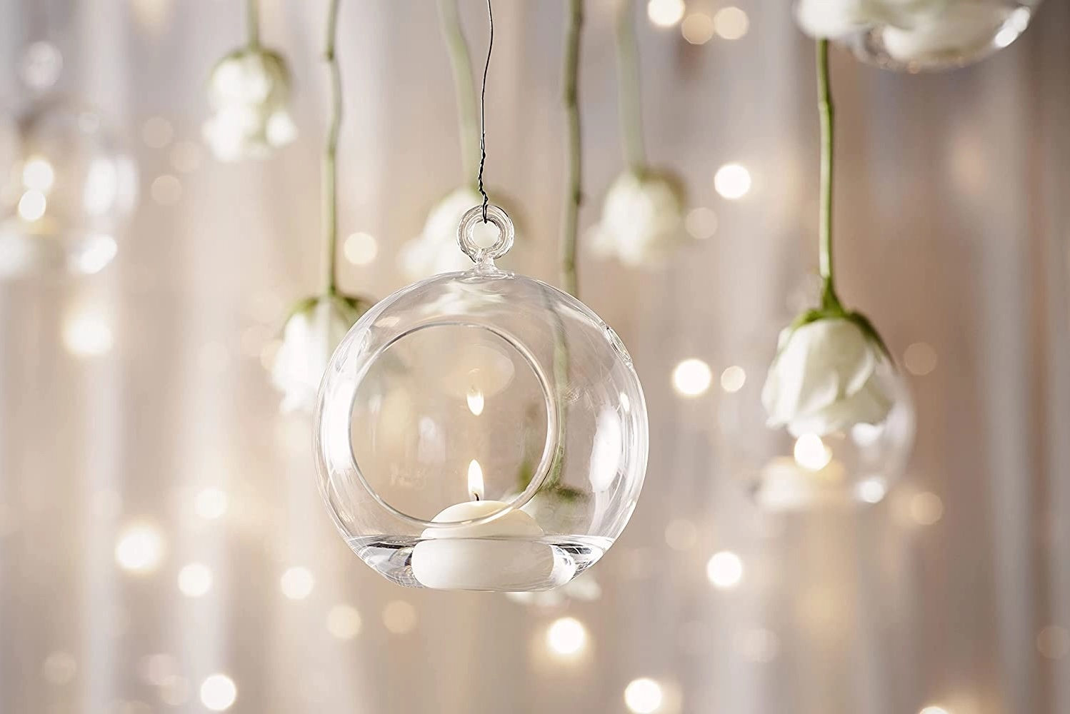 Floating candles in glass domes.