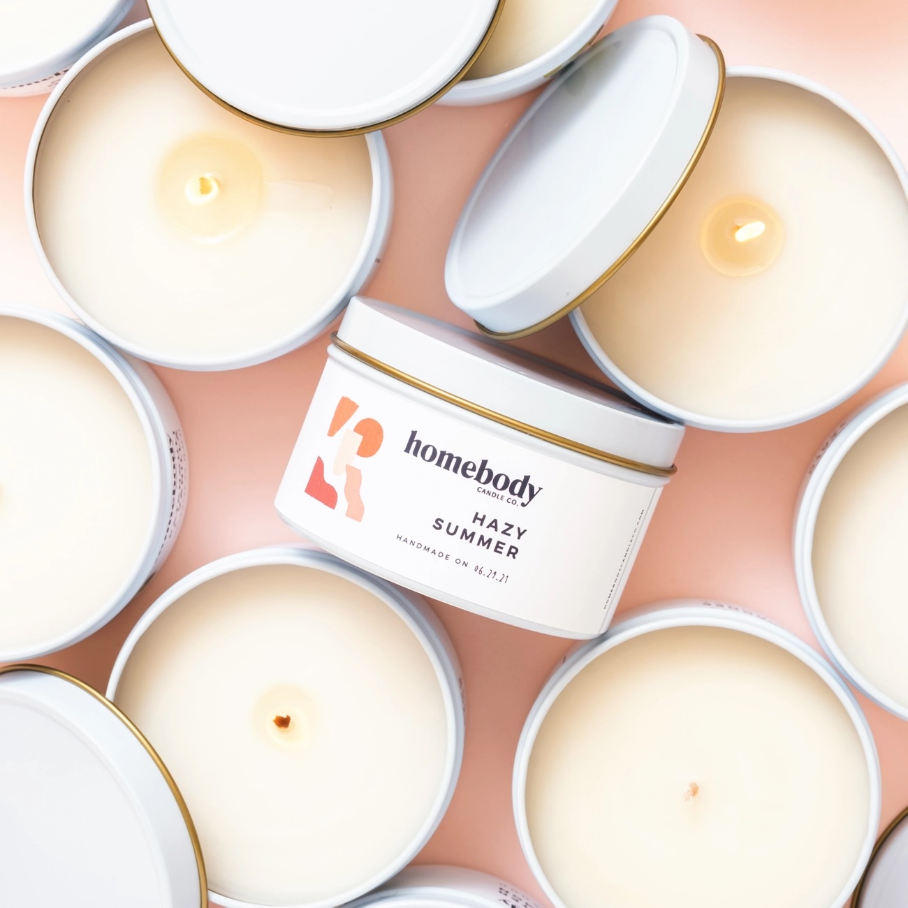Tin container candles from Homebody with a Hazy Summer label.